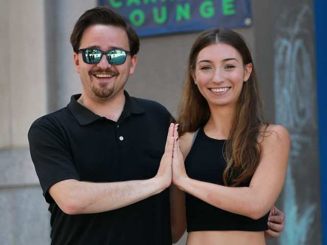 Higher Limits co-owner Jon Liedtke and yoga instructor Elyse Carvalho pose outside the Ouellette Avenue lounge, which is hosting a marijuana-yoga event Sunday as part of the Open Streets event. DAN JANISSE / WINDSOR STAR