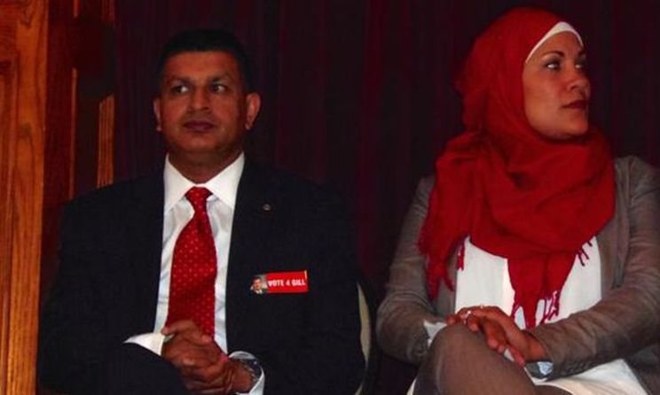 Windsor-Tecumseh Liberal candidate Jeewen Gill sits with defeated candidate Remy Boulbol - Omar Raza