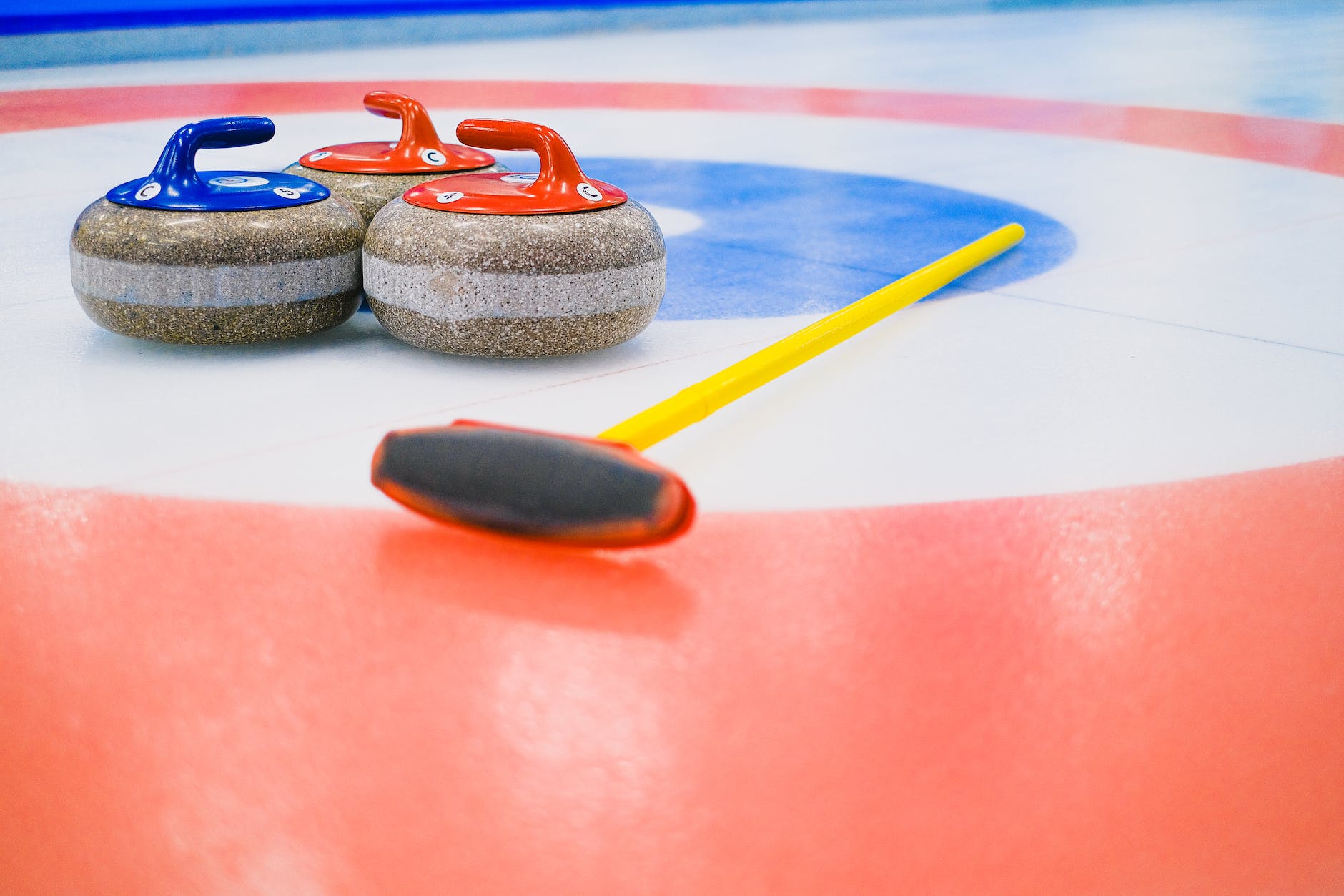curling equipment on ice sheet (Photo by SHVETS)