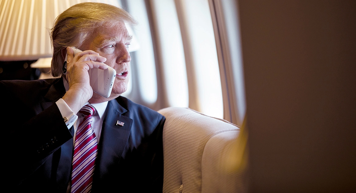 President Donald Trump talks on the phone aboard Air Force One during a flight to Philadelphia on Jan. 26, 2017. | Shealah Craighead/Official White House Photo
